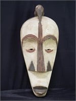 African carved wood mask with hanging wire