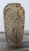 Stone vase with woven split-bamboo strapping