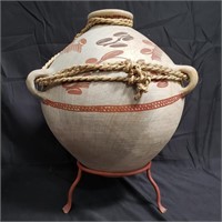 Native American style pottery vase with stand