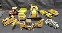 Large group of metal toy trucks, farm equipment,