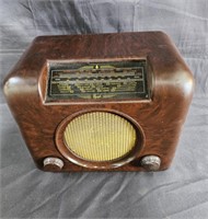 Antique Bush desktop radio, on floor.
