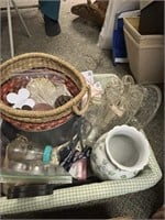 white basket with other baskets, vases, cake pan,
