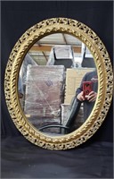 Vintage gilt wood framed oval wall mirror