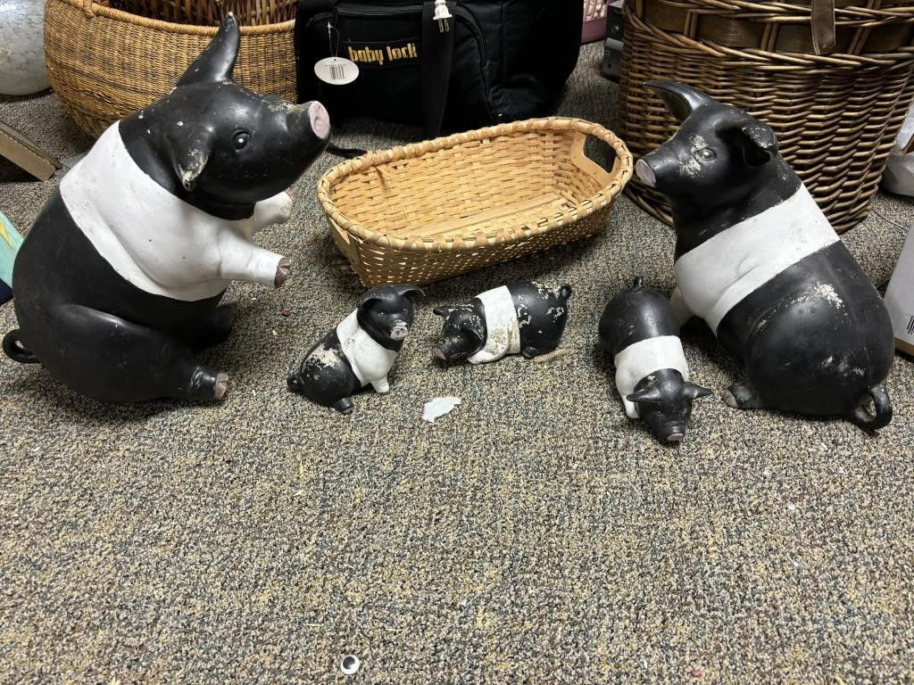 2 large and 3 small pigs all black and white