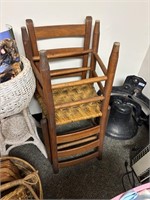 2 wooden highback chairs with wicker woven seats