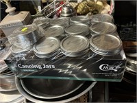 new dozen pint canning jars with extra lids,