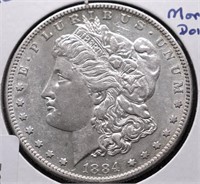 1884 S MORGAN DOLLAR AU