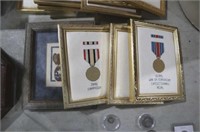 COLLECTION OF FRAMED NEEDLE POINT MEDALS