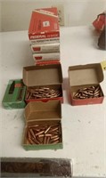 FIVE BOXES SOME BRASS AND BULLETS 9 MM