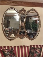 Large ornate double oval mirror