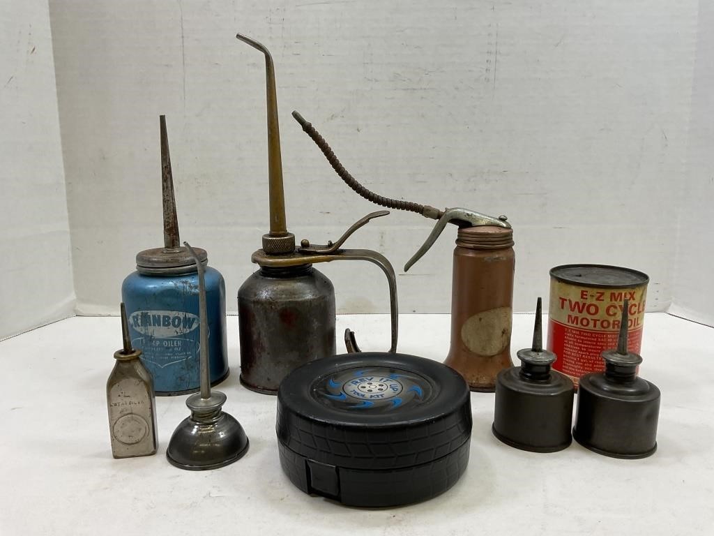 lot of assorted handy  oilers and chainsaw oil can