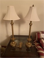 Pair of candlestick lamps, gold in color,
