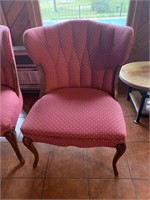 Side chair with tuffetted back, wood legs & edging