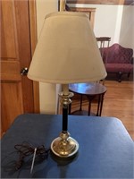 Brass and black lamp with cream shade