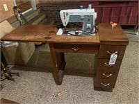 Singer Sewing Machine in cabinet