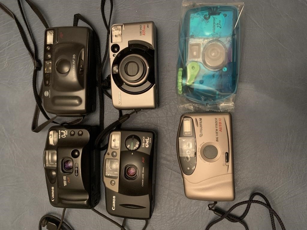 3 Canon cameras, 1 Minolta, 1 fugi film, and