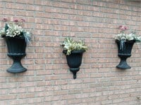 Three plastic wall planters about twenty inches