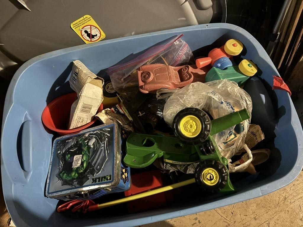 tote with lid filled with toys, cars, train, army