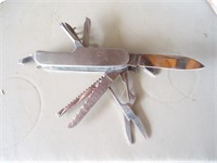 E3) Good condition used 11 function knife.It has