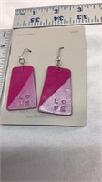 Of-PINK EARRINGS WITH THE WORD LOVE ETCHED