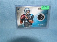 Cam Newton rookie football card with game used mat