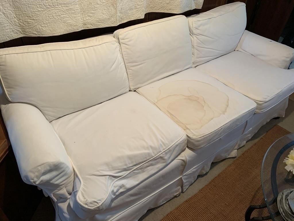UPHOLSTERED SOFA WITH WHITE COVER DOES HAVE STAIN