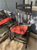 2 BLACK WOODEN ROCKING CHAIRS WITH RED CUSHIONS