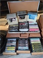 Variety of Cassette tapes in carry case, drawer