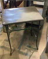 Painted metal accent table measures 27x21x15