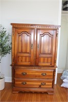 Armoire, two raised panel doors over two drawers,