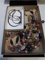 Small flat with costume jewelry I believe some