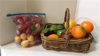 Faux plastic fruit and wicker basket includes