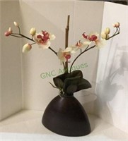 Faux orchid in composite vase measuring
