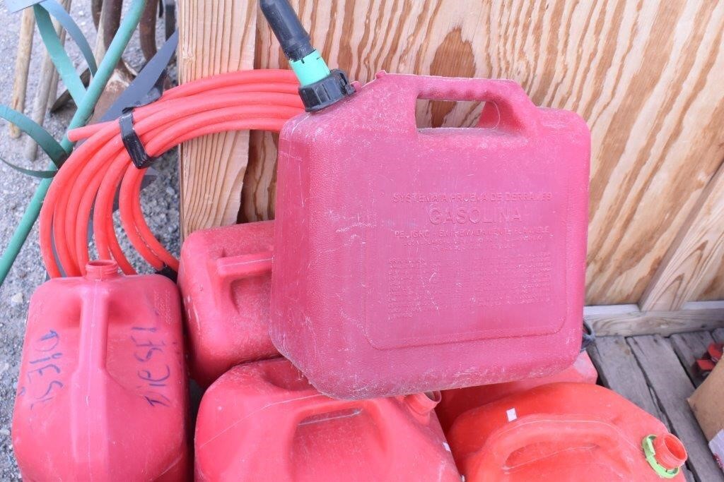 6 Gas cans only one with spout & Tubing