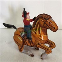 Vintage metal wind up cowboy on horse toy - does