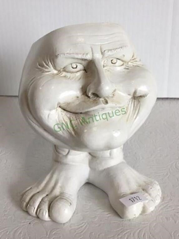 Adorable character face with big feet planter