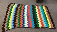 Large colorful crochet throw measures 74 x 50.