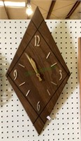 Unique diamond shaped wooden wall clock.