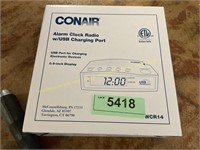 Conair alarm clock radio with USB charging port
