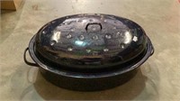 Large blue enamel roasting pan with lid.