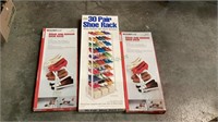 Three shoe racks - all new in box. The largest