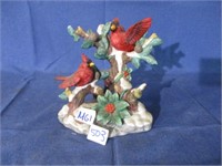 Cardinal bird figurine .