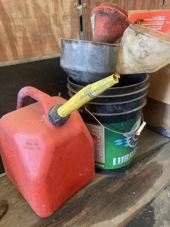 Assorted funnels and a 20L gas can.
