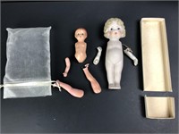 2 baby dolls body parts.  1 composite with arms