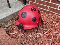 Lady bug helmet yard art