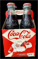 One 4 Pack of 2012 Holiday Coca Cola