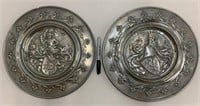2 antique medieval style bas relief pewter plates