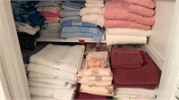 2 SHELVES OF TOWELS, WASHCLOTHES, ETC
