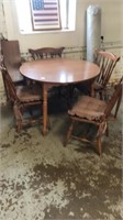Wood round table,4 chairs w cushions ,1 leaf