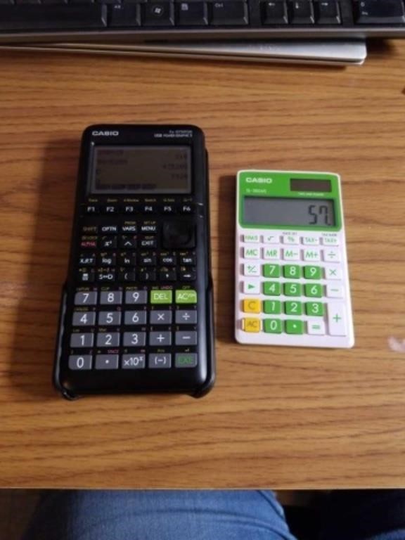 2 casio calculators FX9750GII and casio SL 300 VC